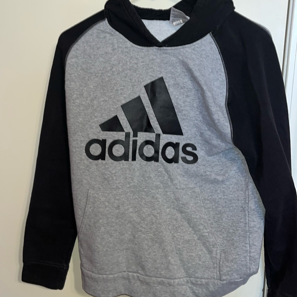 Gray Adidas hoodie- black sleeves, hood, and logo-